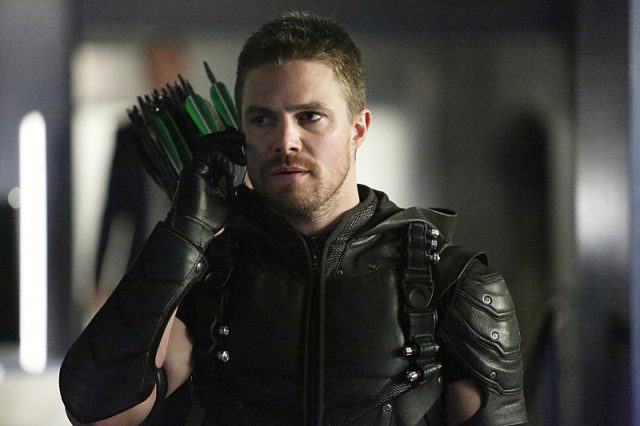 Stephen Amell as Oliver Queen/Green Arrow.